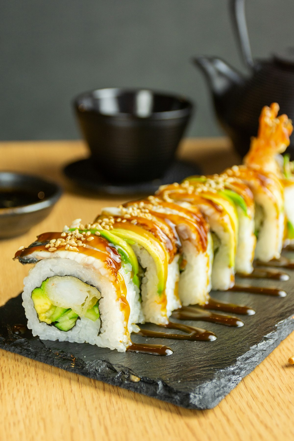 Signature dragon roll topped with fresh avocado slices